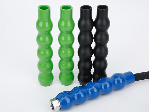 Several 4-finger hose bend restrictors and assembled hoses.