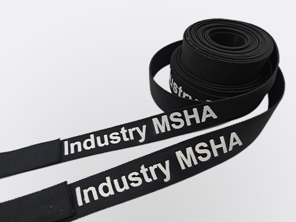 Two rolls of exact-flex hydraulic hose nylon sleeve with white printing.