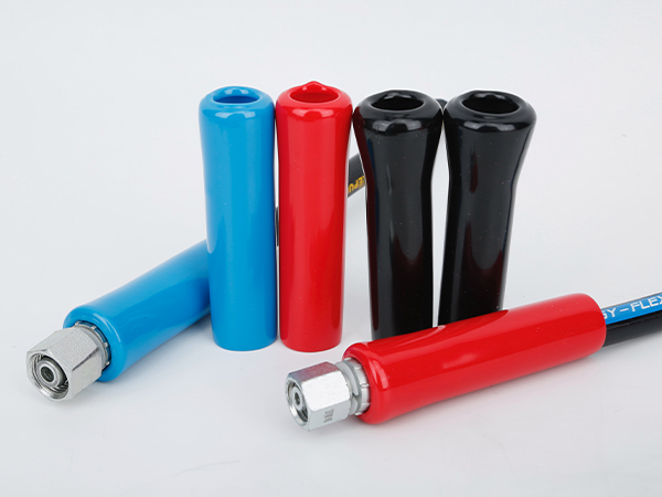 Several sleeve straight hose bend restrictors and assembled hoses.